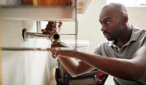 a male plumber fixing a bathroom faucet from Plumber Georgetown in Georgetown, TX - Georgetown, TX a male plumber fixing a bathroom faucet from Plumber Georgetown in Georgetown, TX - Georgetown, TX